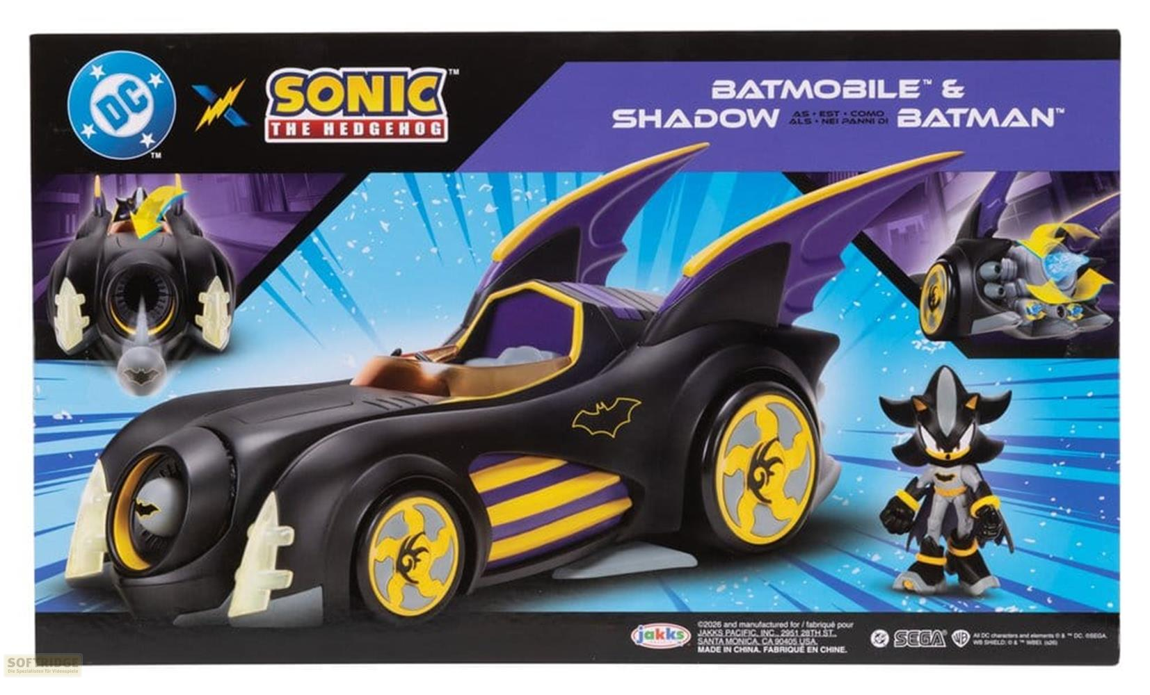 Batmóvil y figura de Shadow junto al empaque. Son negros con acentos amarillos.