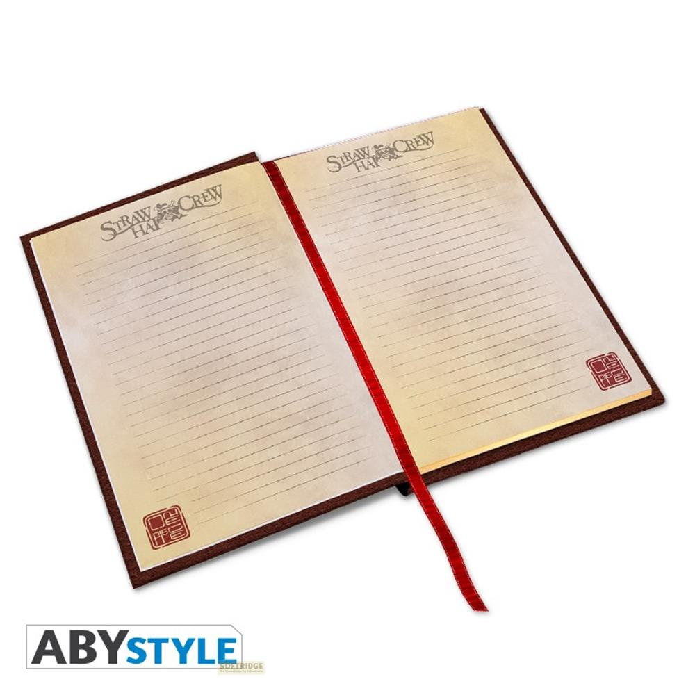 Un carnet ouvert avec une couverture marron et des sceaux rouges.