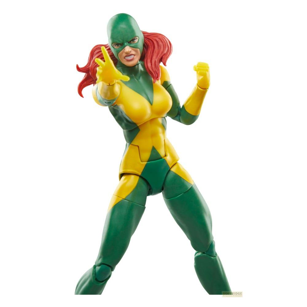 Figura de acción de mujer con traje verde y amarillo, pelo rojo y máscara.