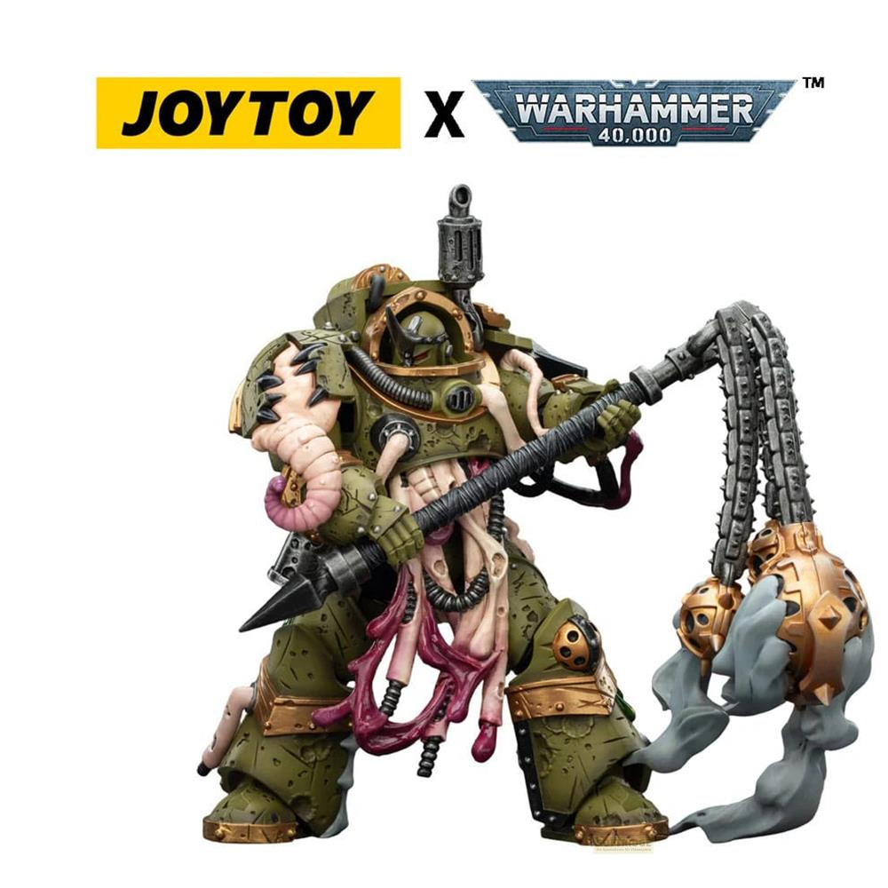 Zielona figurka Warhammer 40k z łańcuchem i złotą głową.