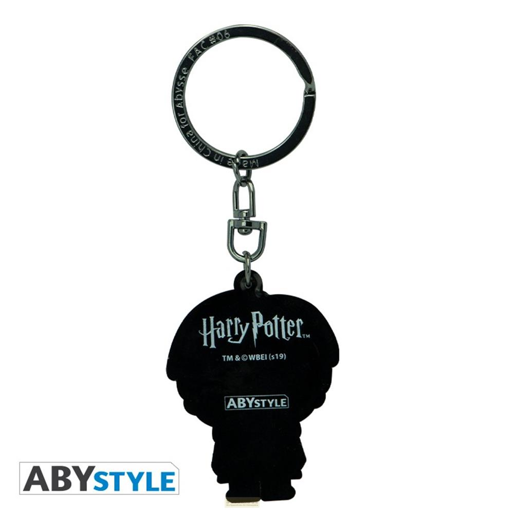 Un llavero de Harry Potter con figura de silueta y logo.
