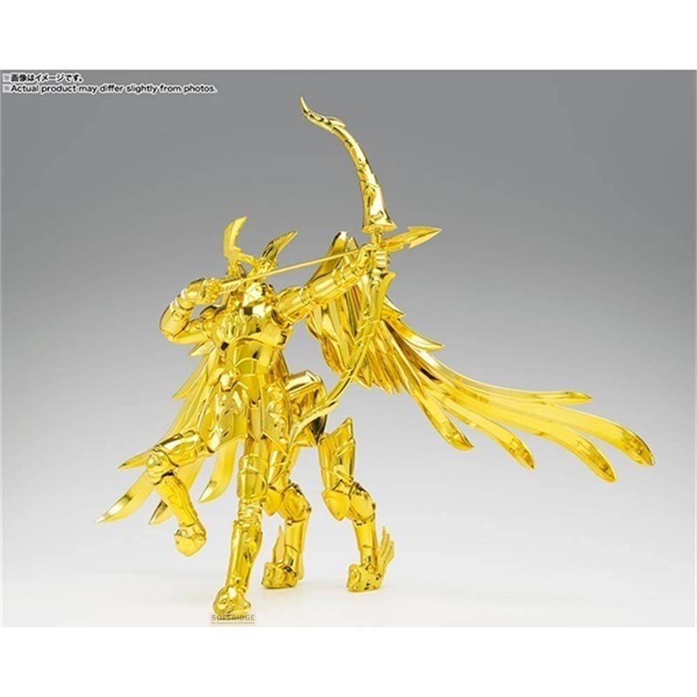 Figura dorada con alas, sosteniendo un arco y flecha, sobre fondo gris.