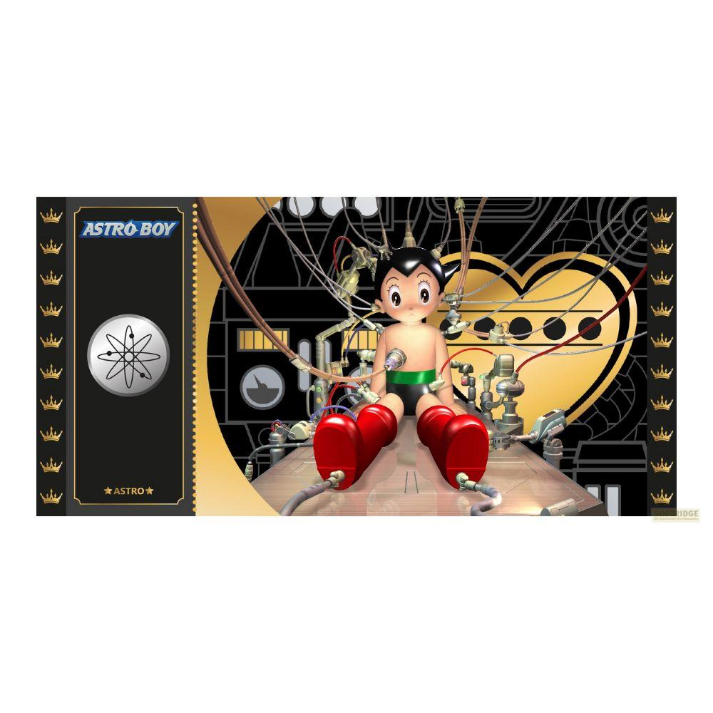 Astro Boy sitzt in einer Maschine mit Kabeln und einem Herzsymbol im Hintergrund.