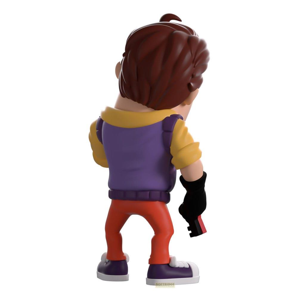 Eine Figur mit braunen Haaren, gelbem Hemd, violetter Weste, roten Hosen und schwarzen Handschuhen.