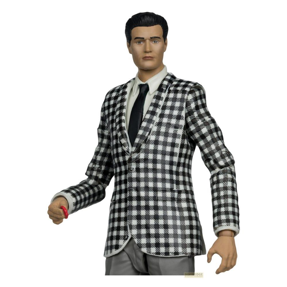 Una figura con traje a cuadros, corbata y pantalones.