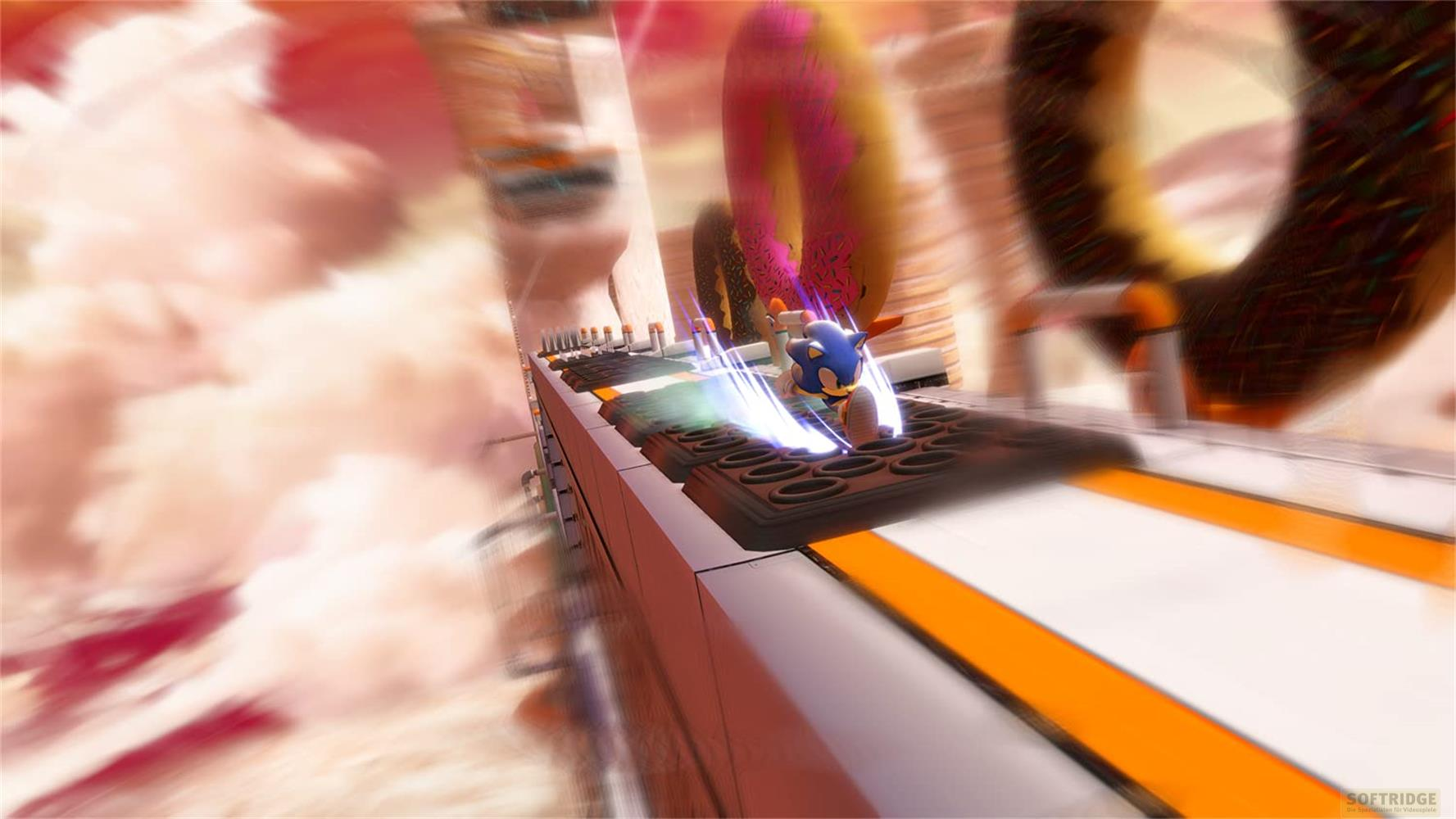 Sonic file sur une piste avec des donuts géants et des nuages dans le ciel.