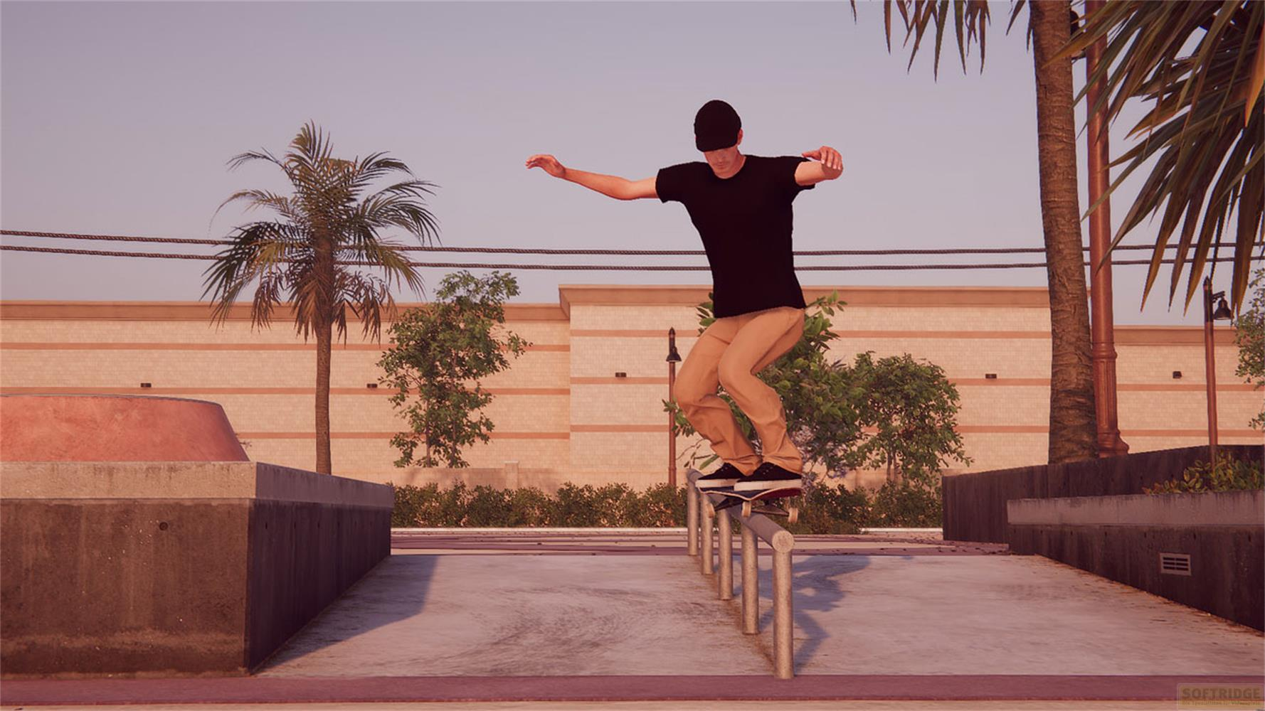 Un skateur fait un grind sur une barre dans un skatepark avec des palmiers et des bâtiments.