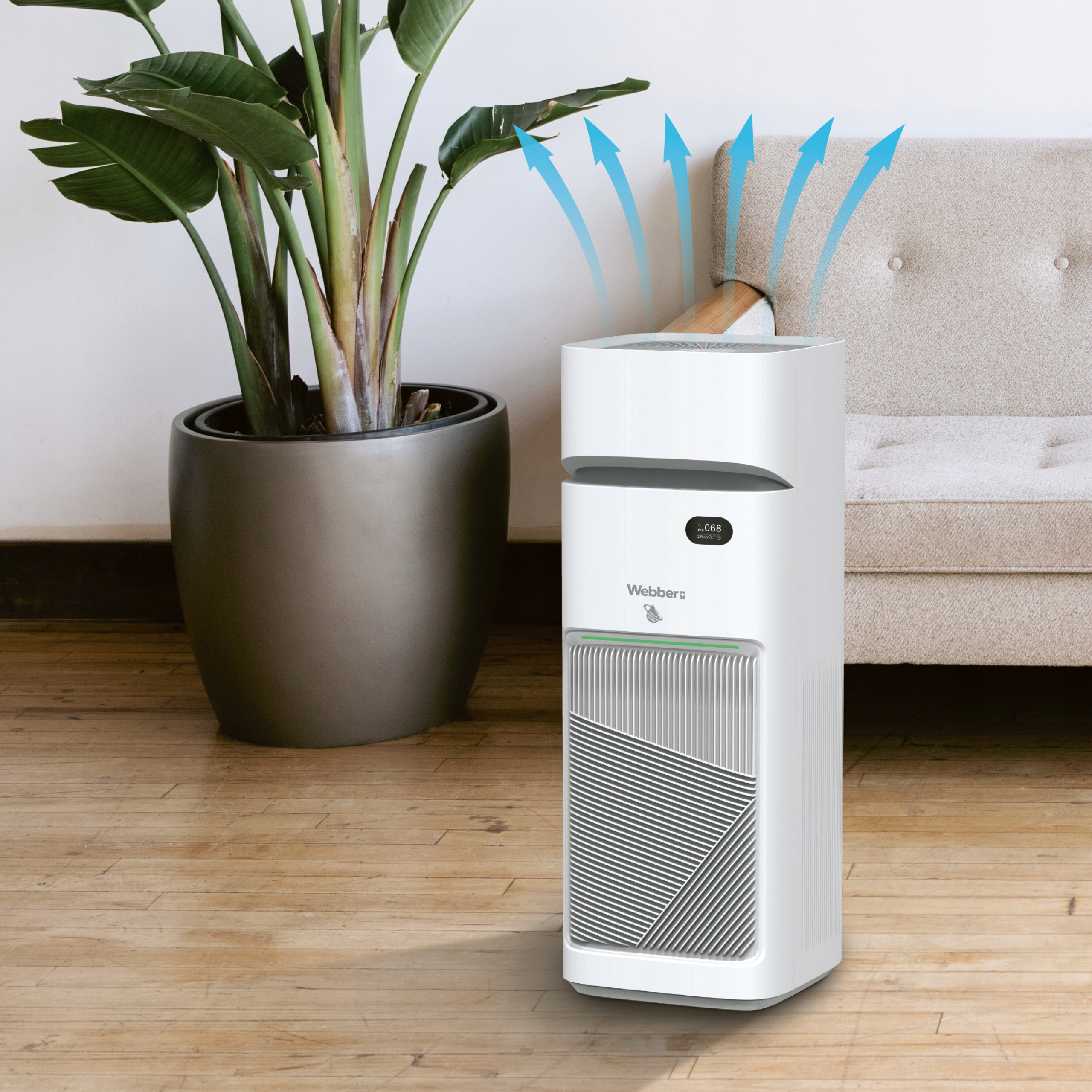 Biały oczyszczacz powietrza stoi obok dużej rośliny doniczkowej na drewnianej podłodze.
