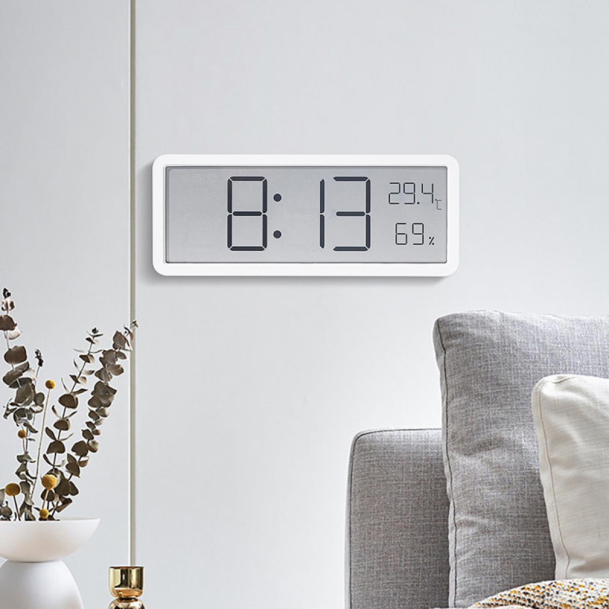 Ein digitaler Uhren-Thermometer zeigt 8:13 Uhr, 29,4°C und 69% Luftfeuchtigkeit.
