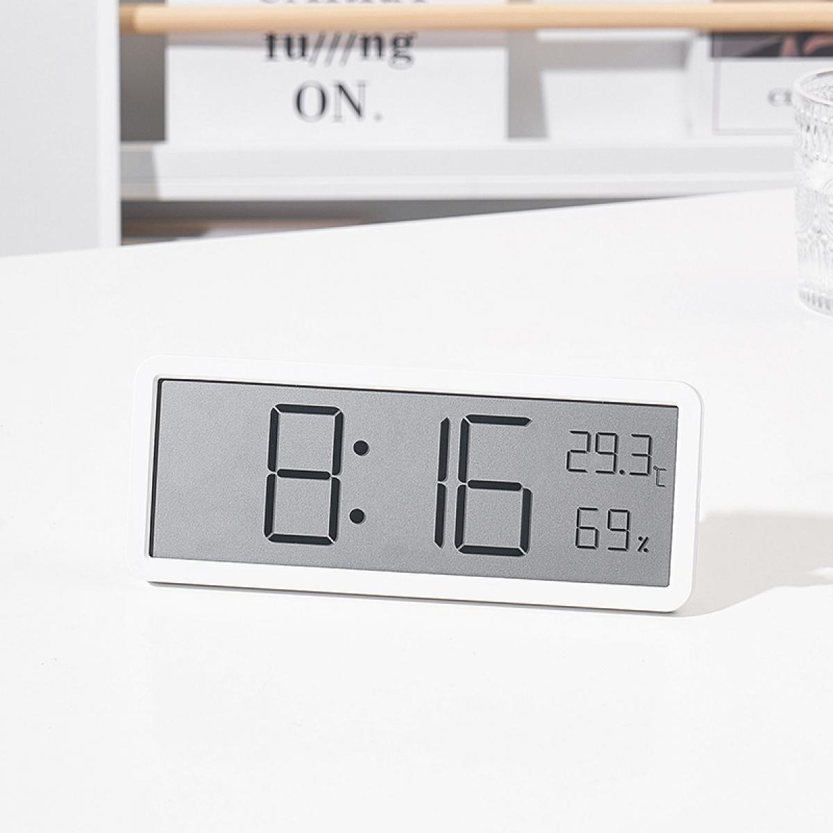 Ein digitaler Wecker zeigt 8:16 Uhr, 29,3 Grad und 69 % Luftfeuchtigkeit an.