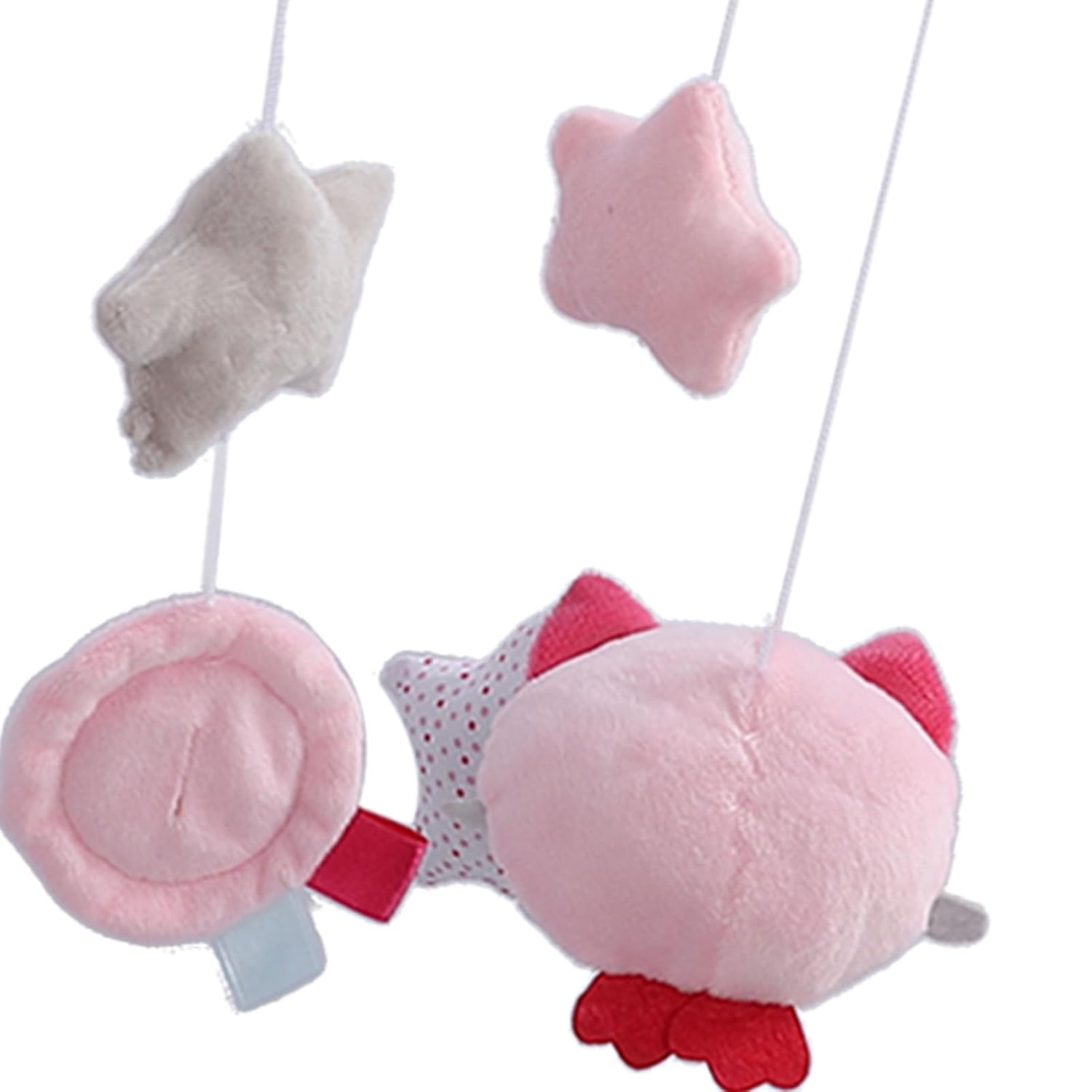 Weiche Spielzeuge: ein grauer Stern, ein rosa Stern, ein rosa Schwein und ein rosa Kreis.