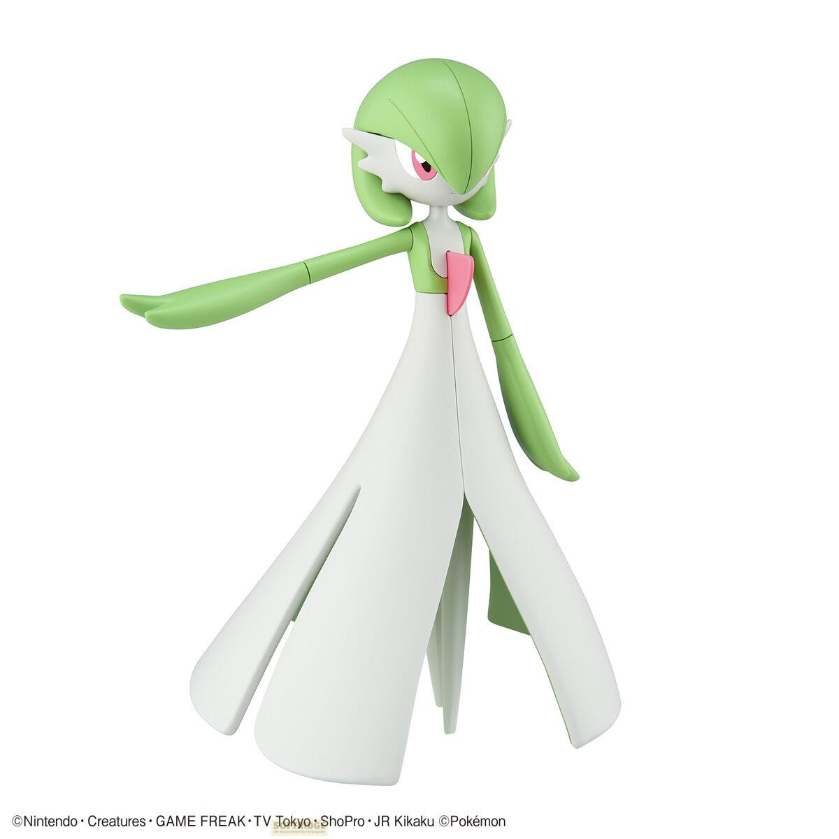Une figurine Gardevoir verte et blanche avec des touches roses sur fond blanc.