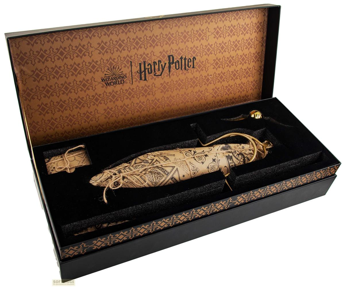 Harry Potter Geschenkbox mit einem goldenen Schnatz und einer Feder-Schreibfeder auf schwarzem Samt.