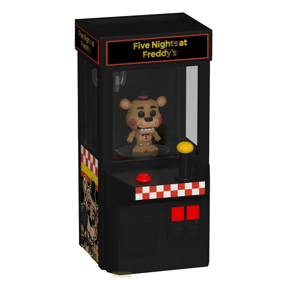 Una máquina de garra de Five Nights at Freddy's con una figura de Freddy dentro.