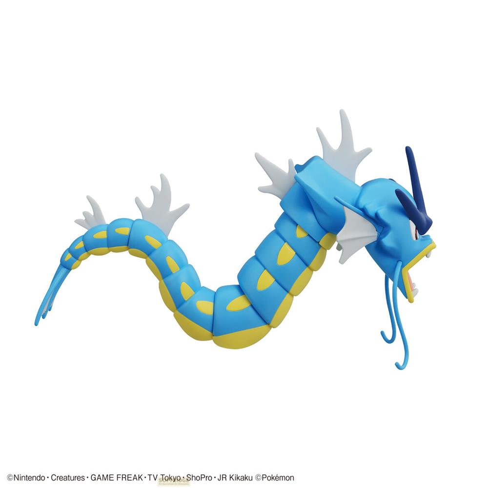 Une figurine Pokémon bleue et jaune avec un long corps et des nageoires blanches.