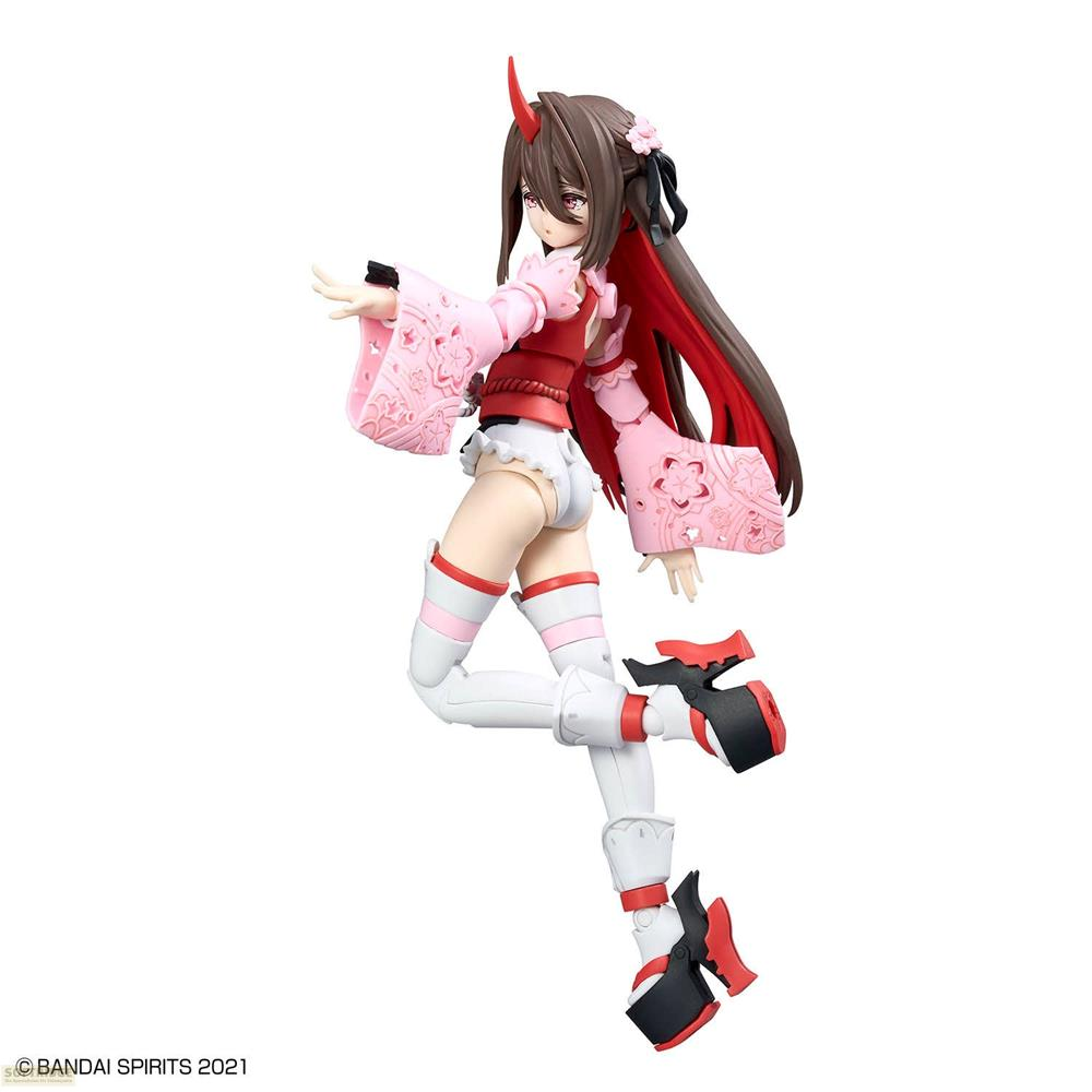 Figurine avec cornes rouges porte un kimono rose et des vêtements blancs.