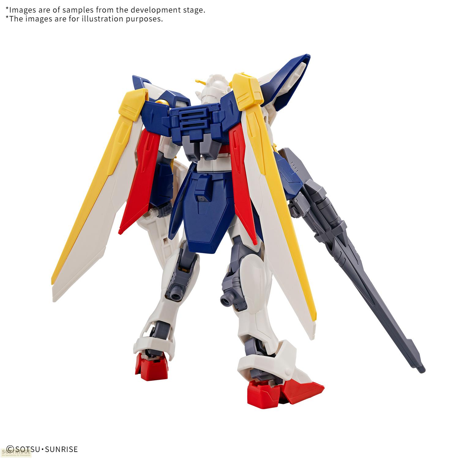Un robot bleu et blanc avec des accents jaunes et rouges tenant une arme.