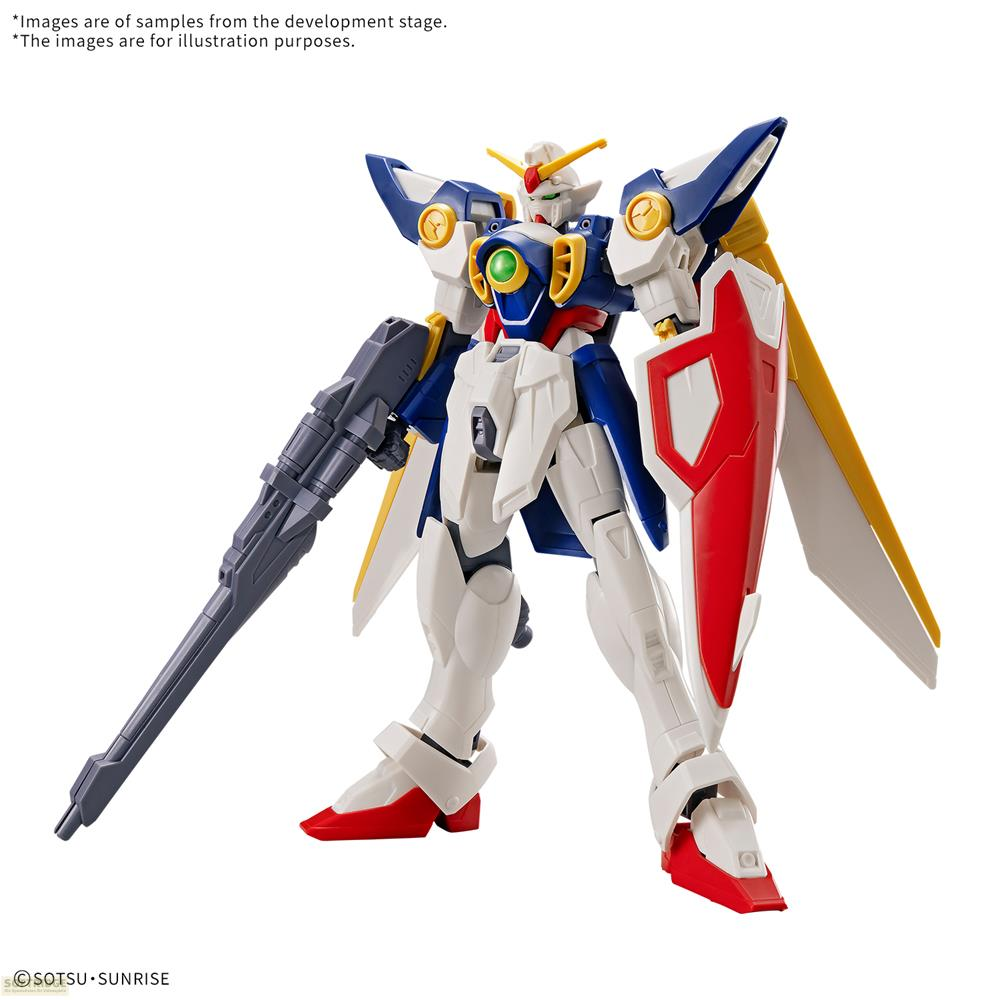 Un robot blanc, bleu et rouge tenant un fusil, avec des ailes jaunes.