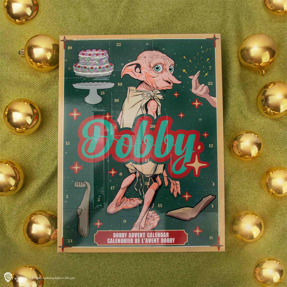 Un calendario dell'Avvento di Dobby circondato da palline dorate, ispirato a Harry Potter.