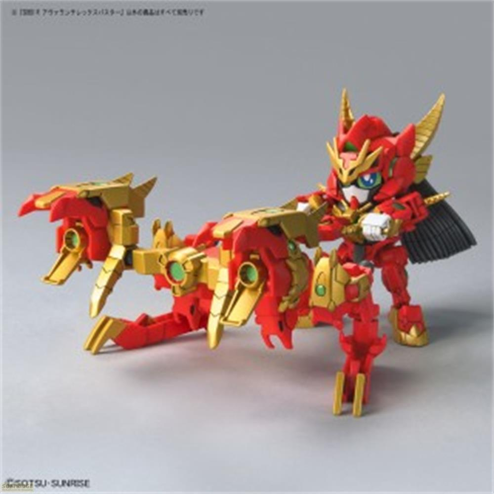 Ein rotes und goldenes Modell eines Roboters mit einem großen, roten und goldenen Gewehr.