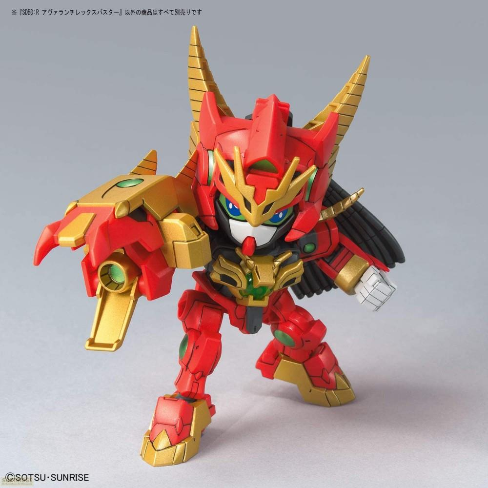 Ein roter und goldener Roboter mit Hörnern und einer großen Waffe am linken Arm.
