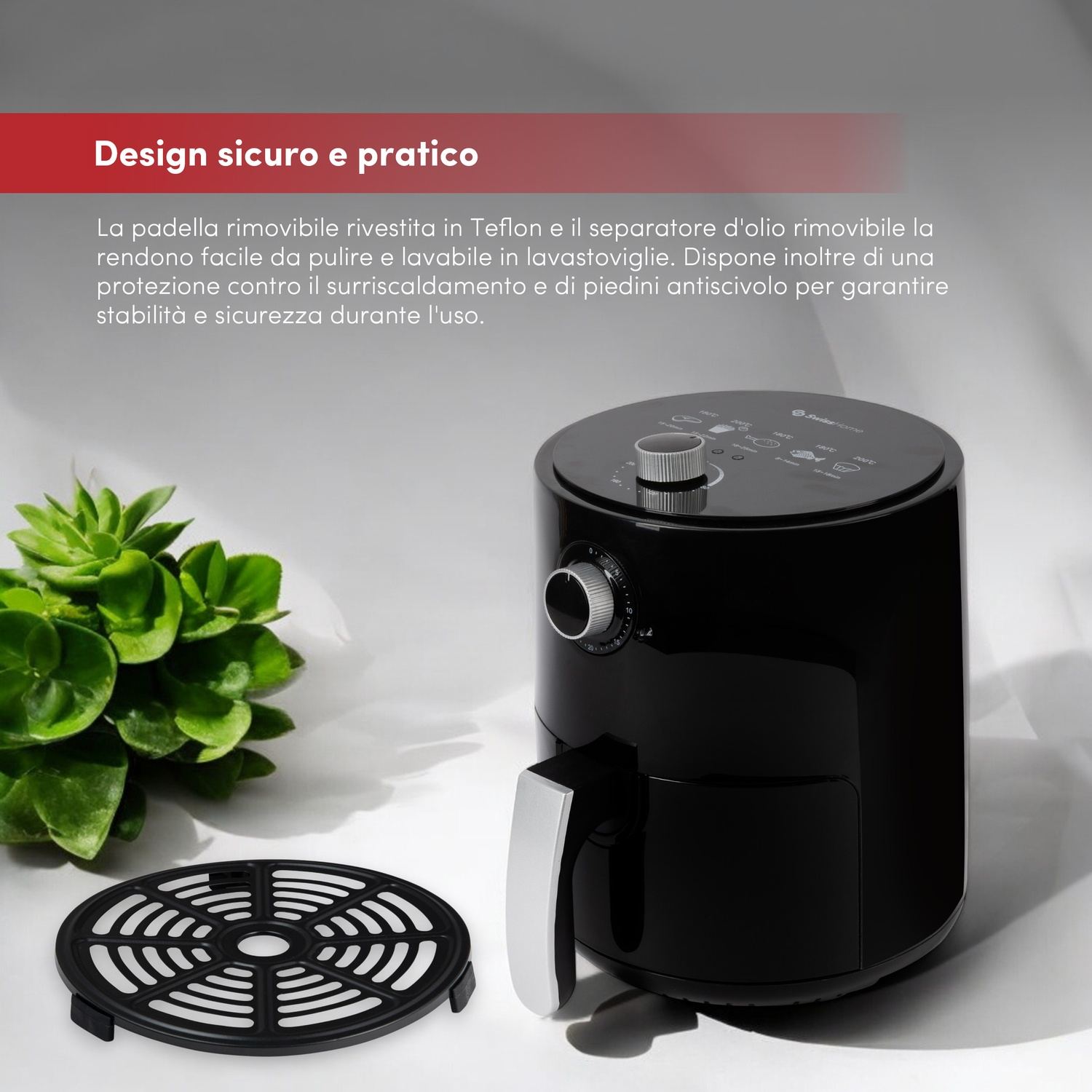 Friggitrice ad aria nera con manico argentato e accessori accanto.