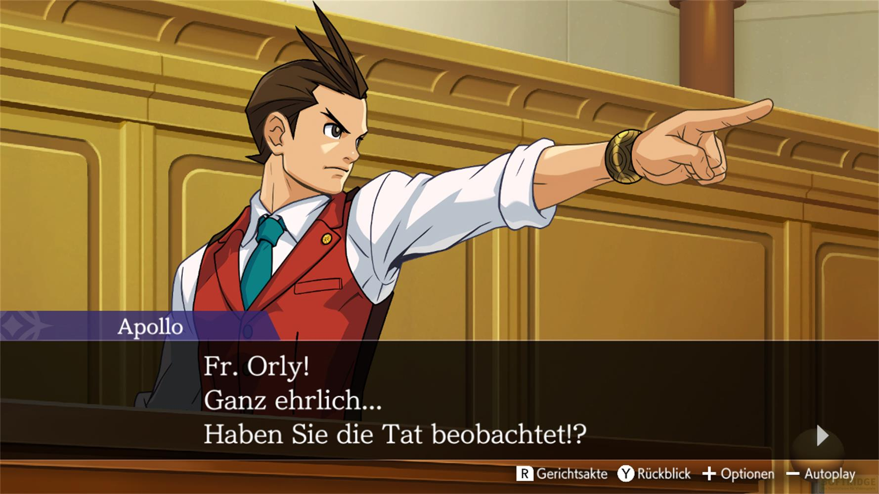 Apollo Justice in tribunale con gilet rosso, che indica.