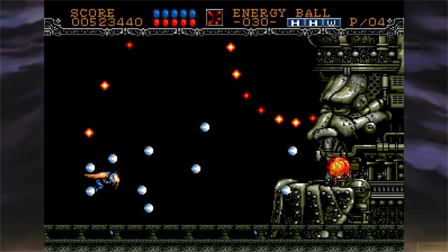 Un'astronave spara sfere a un nemico meccanico in un gioco 2D.