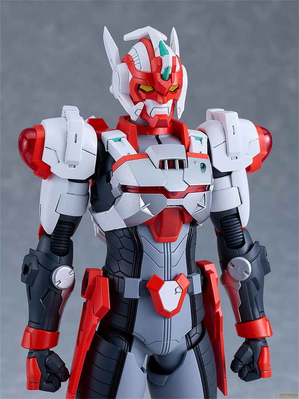 Un robot rouge et blanc aux yeux jaunes sur fond gris.