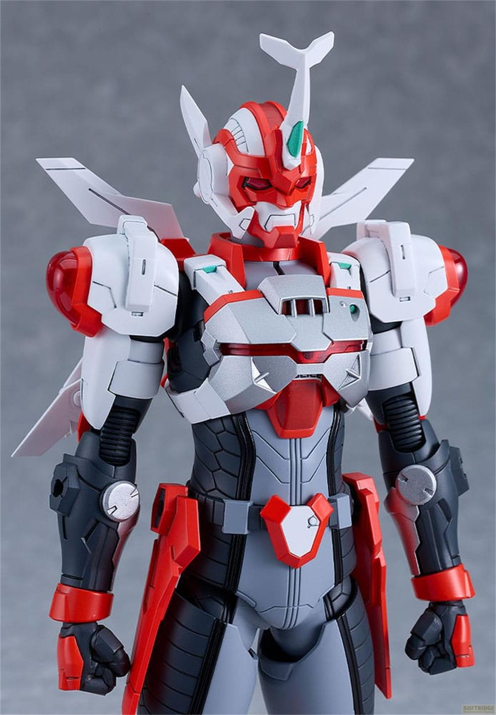 Figurine robot rouge et blanc avec des ailes et une corne sur la tête.