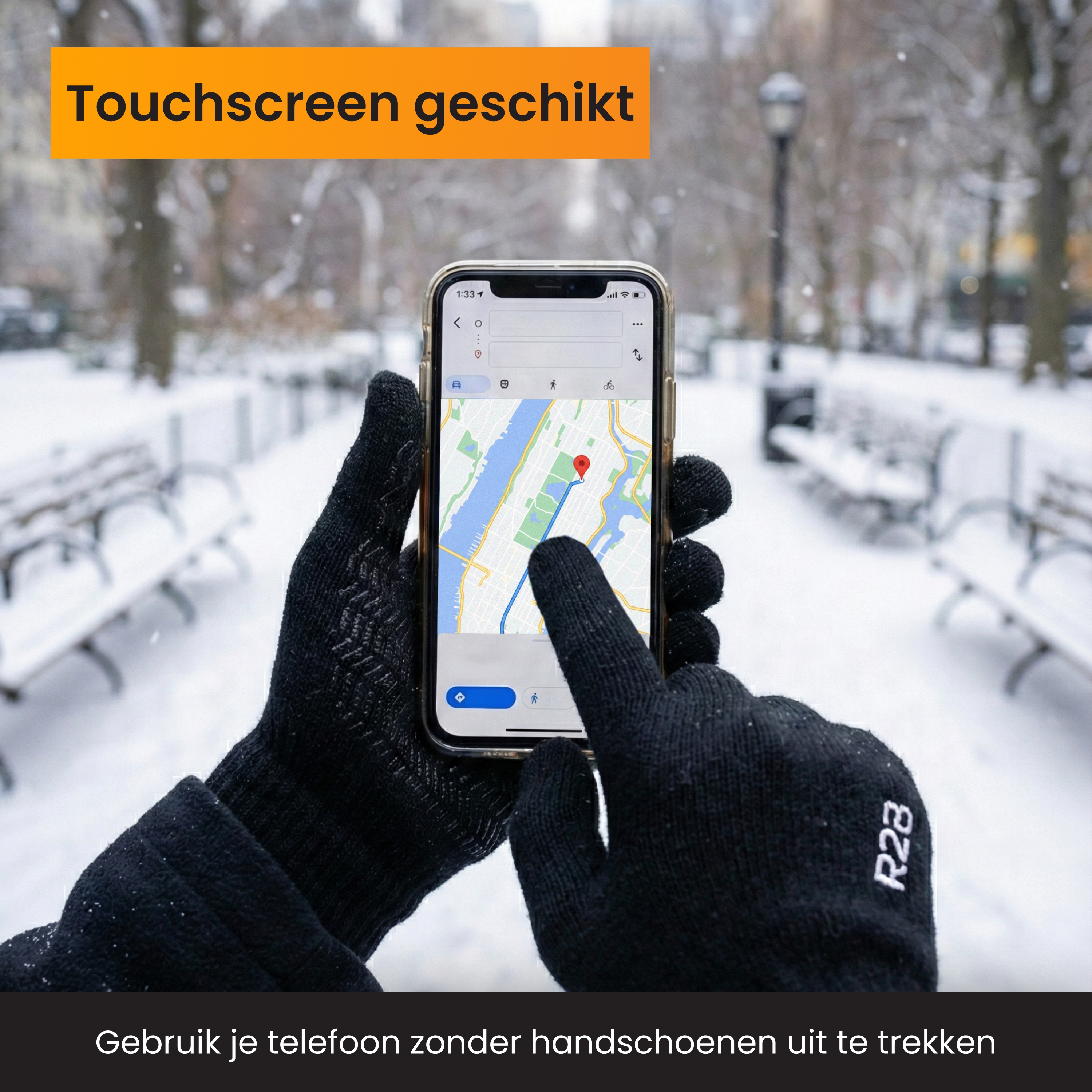 Hands in black gloves operate smartphone with navigation app in snow.