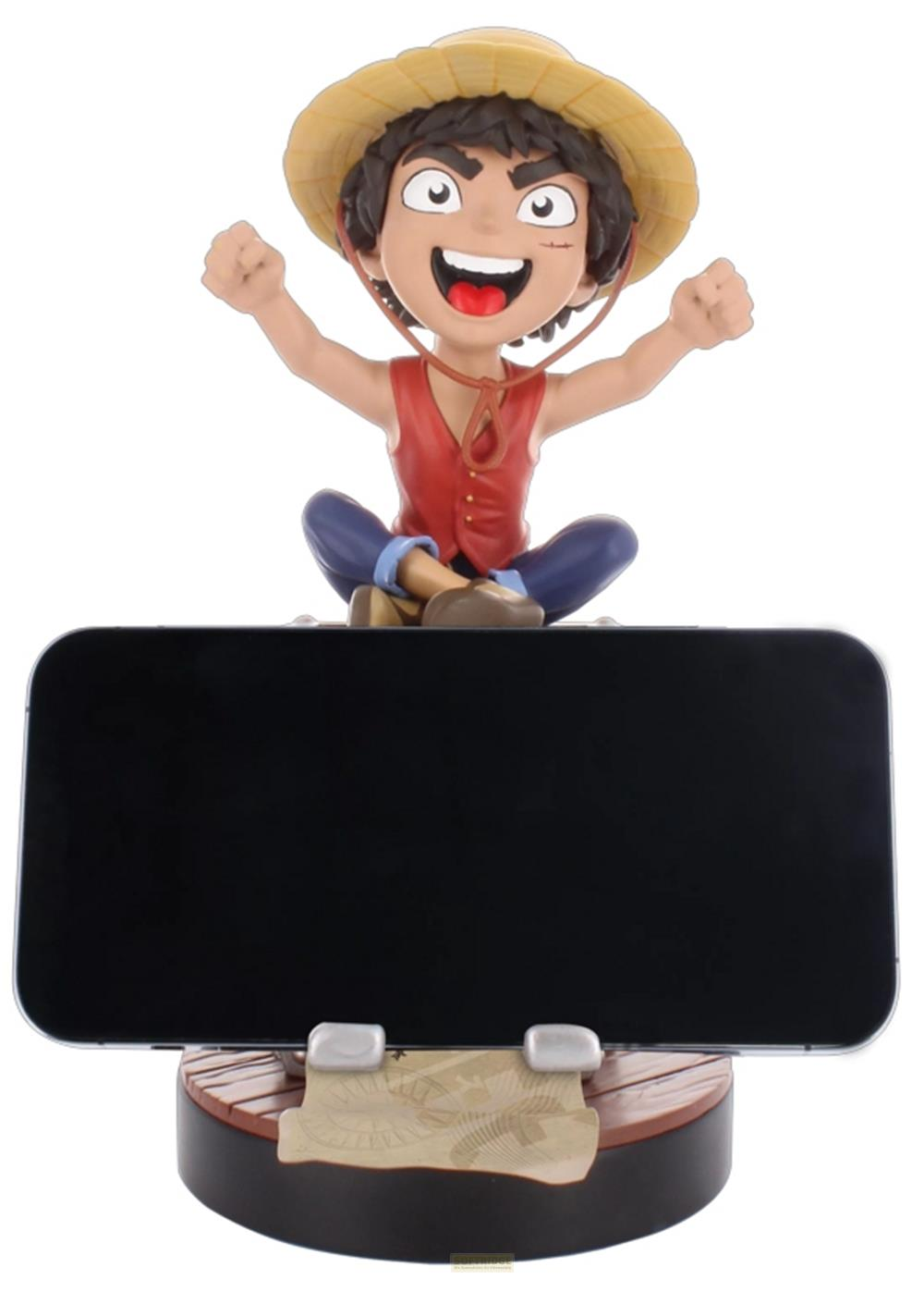Una figura di Luffy siede su un supporto per telefono con design di mappa del tesoro.