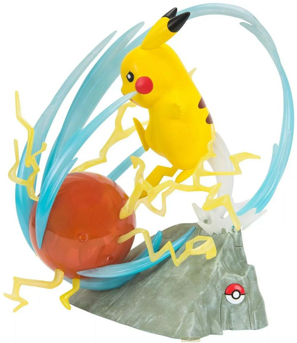 Pikachu-Figur greift mit Blitzangriff einen roten Ball auf Felsen an.