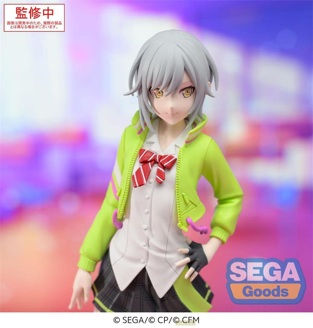 Figur einer jungen Frau mit grauem Haar, die eine grüne Jacke und eine weiße Bluse trägt.