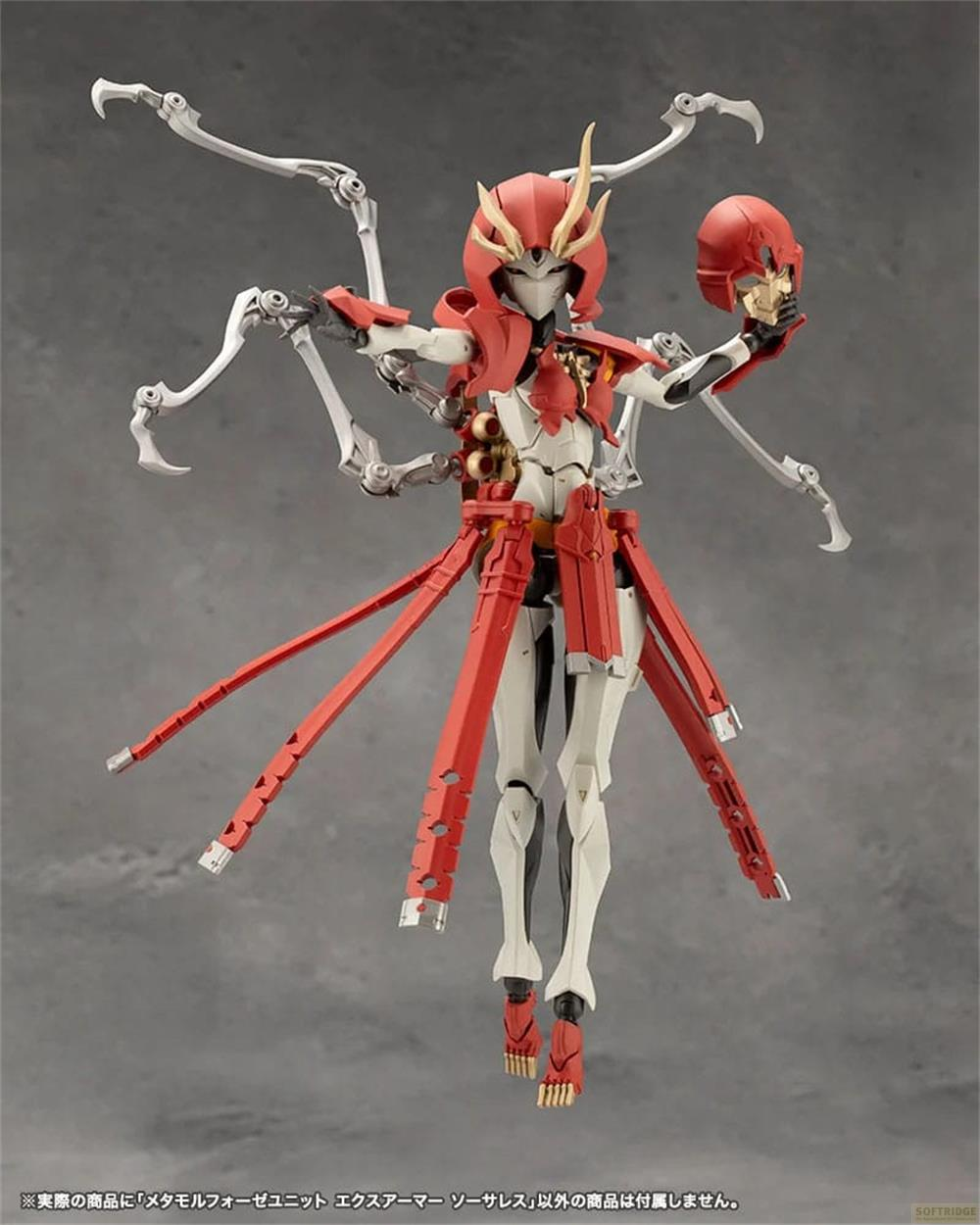 Une figurine rouge et blanche avec de multiples membres tenant un crâne.