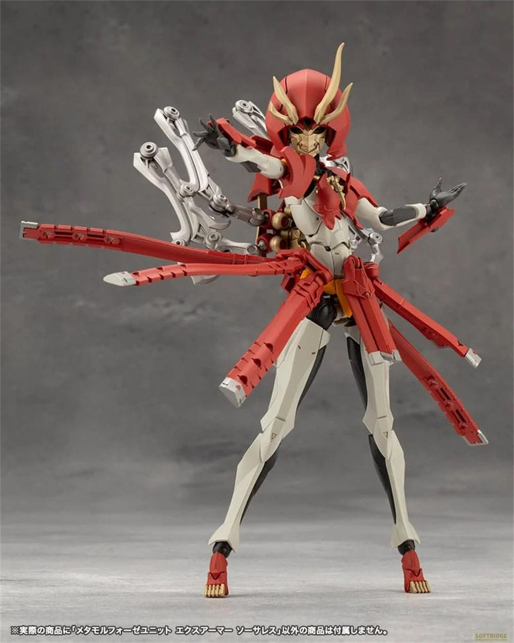 Figurine robot rouge et blanche avec accents dorés et plusieurs bras rouges.