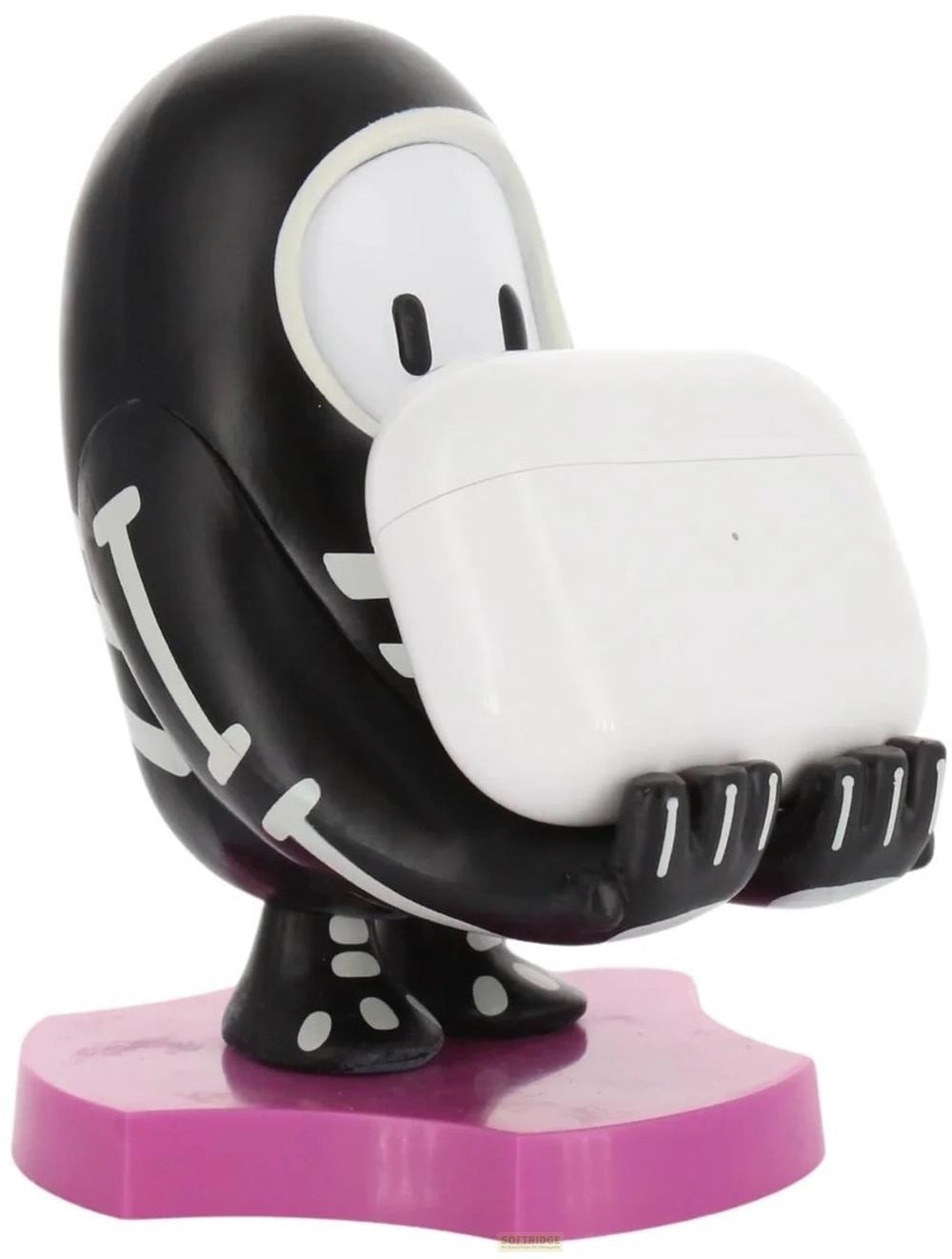 Figura nera con motivo scheletrico tiene una custodia bianca, su base rosa.