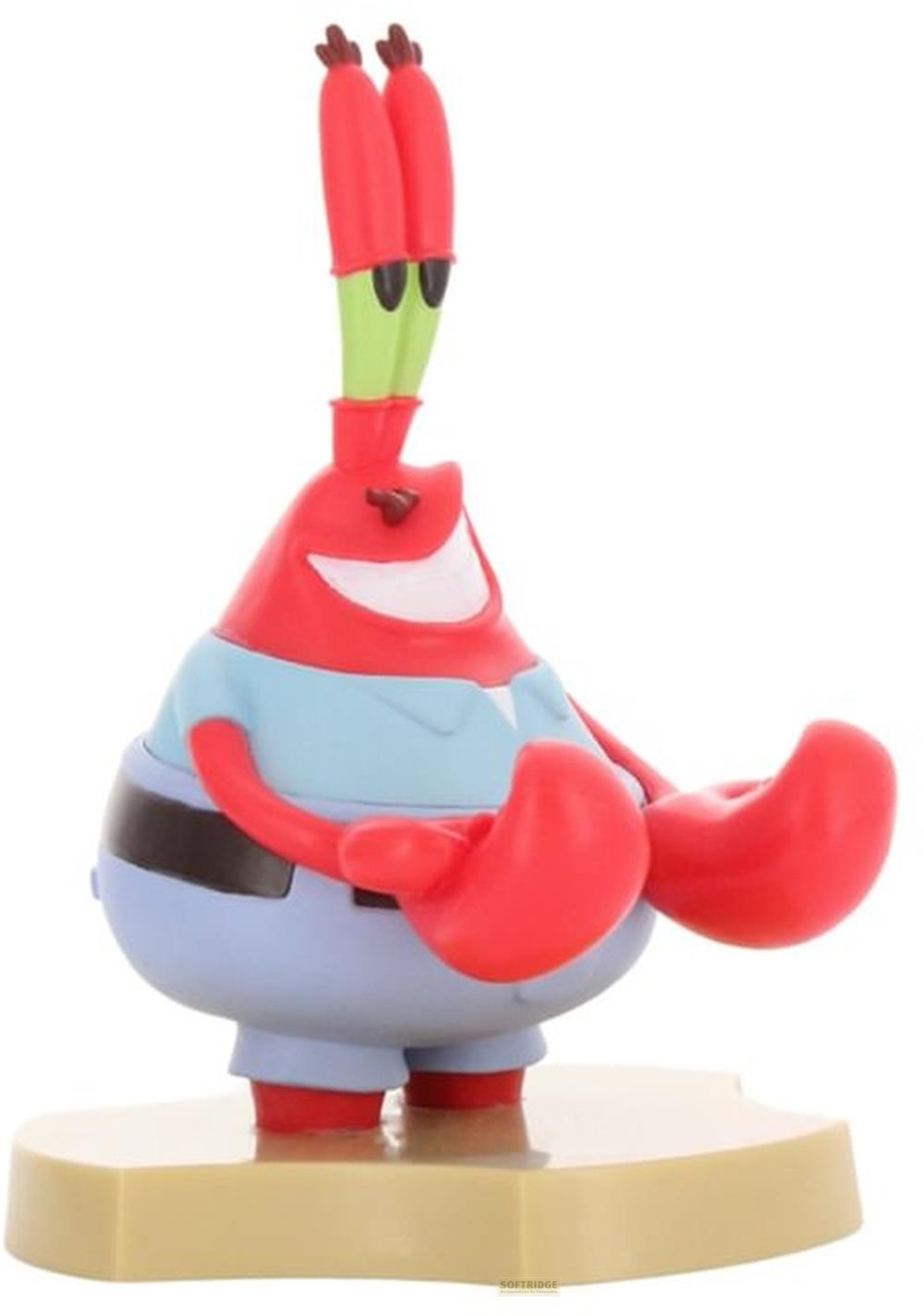 Eine rote Figur mit grünen Antennen und Scherenarmen auf einem beigefarbenen Sockel.