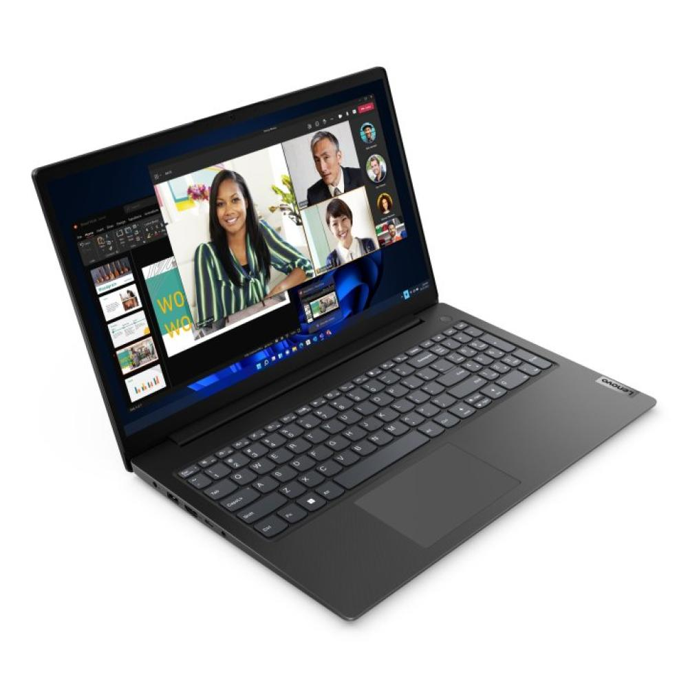 Un portátil abierto muestra una videollamada con cuatro personas en pantalla. Se ve un teclado oscuro.