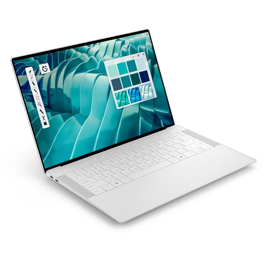 Un portátil blanco que muestra una pantalla con paleta de colores y herramientas de diseño.