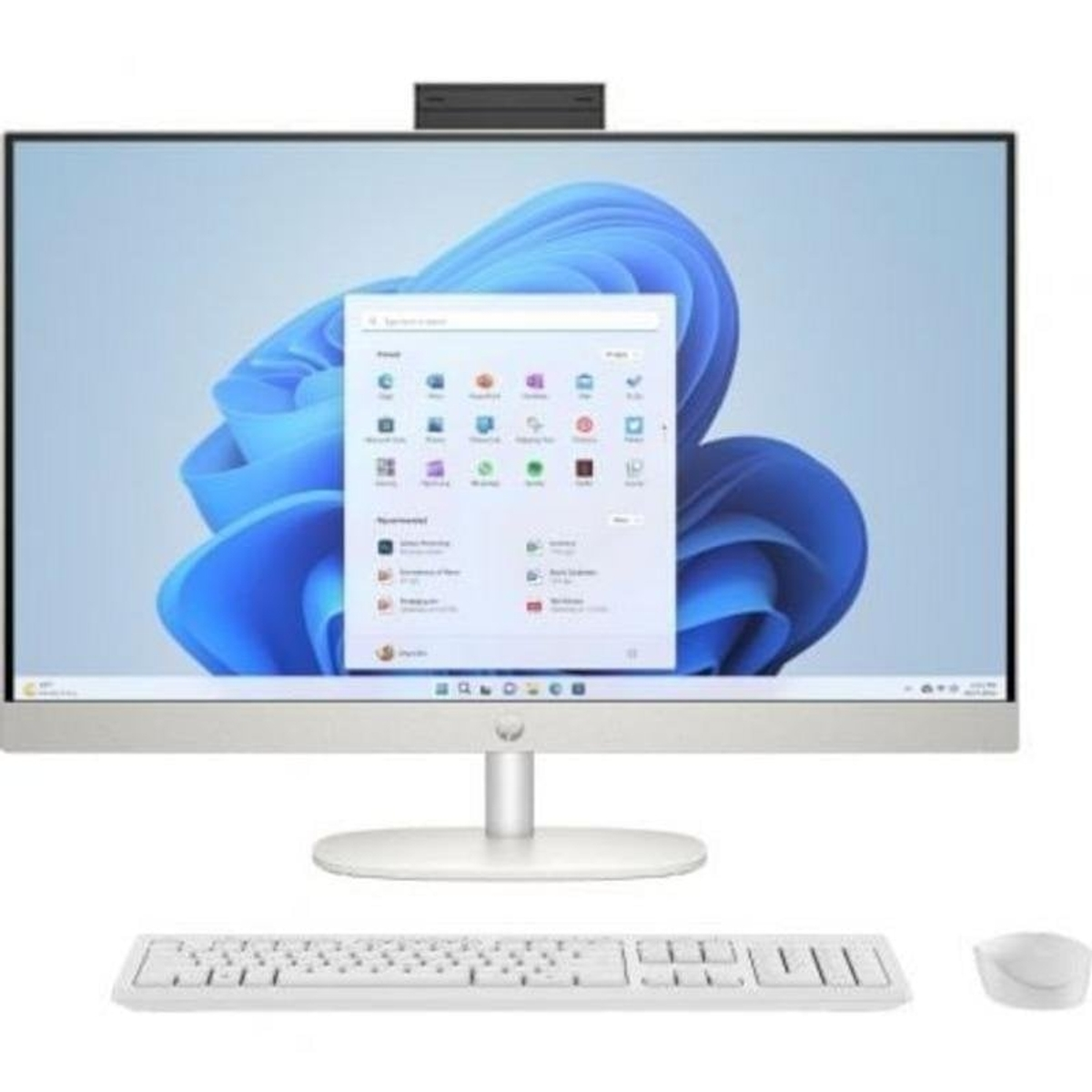 Un moderno ordenador todo en uno con teclado y ratón blancos sobre una superficie blanca.