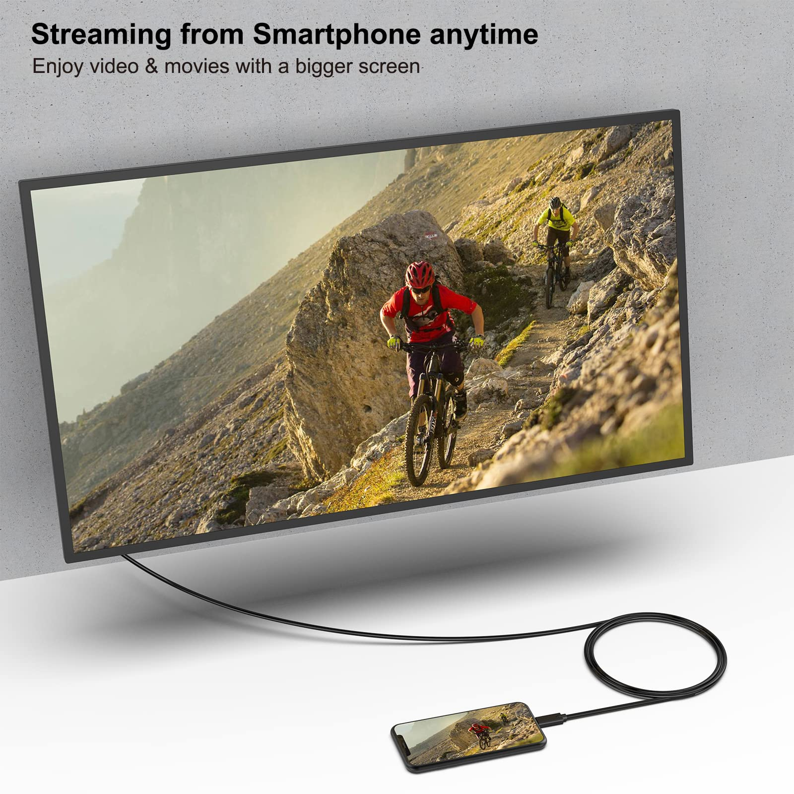 Zwei Mountainbiker fahren auf einem steinigen Bergpfad. Ein Smartphone ist verbunden.