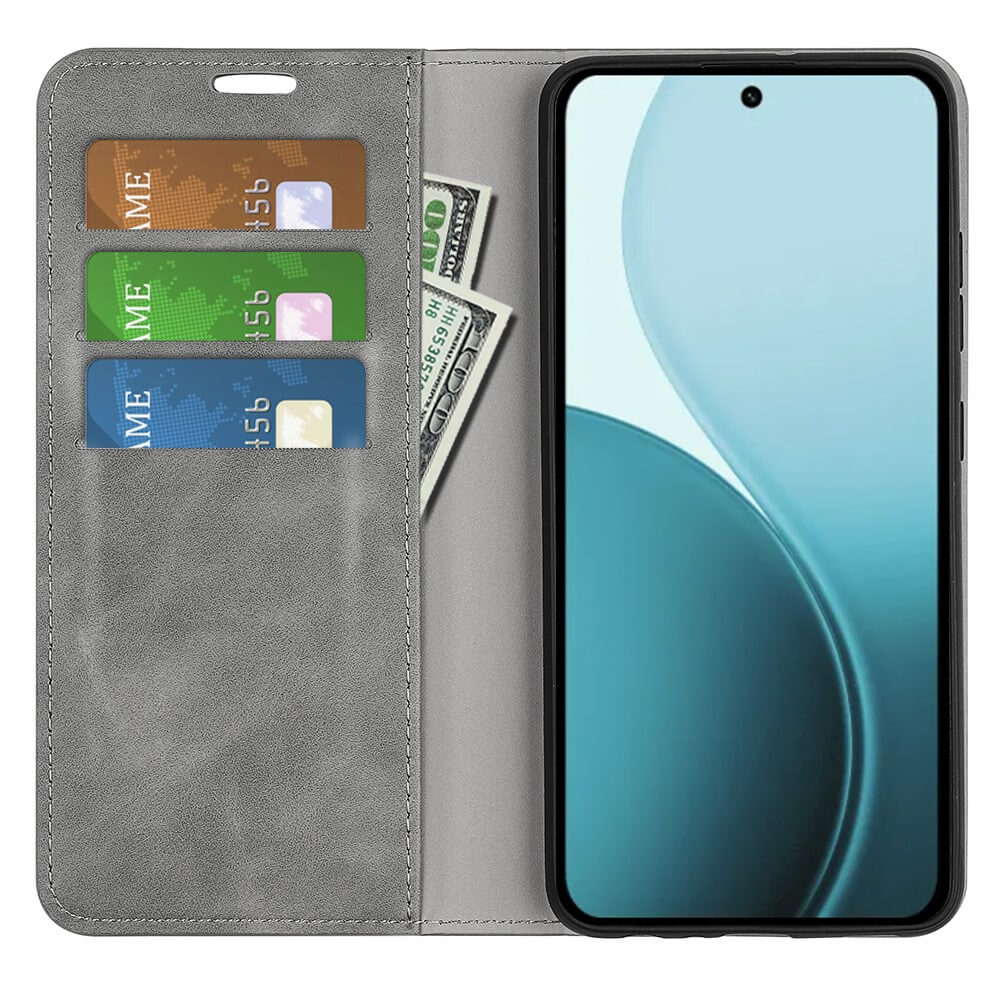 Étui portefeuille gris avec fentes pour cartes et billets, à côté d'un smartphone.
