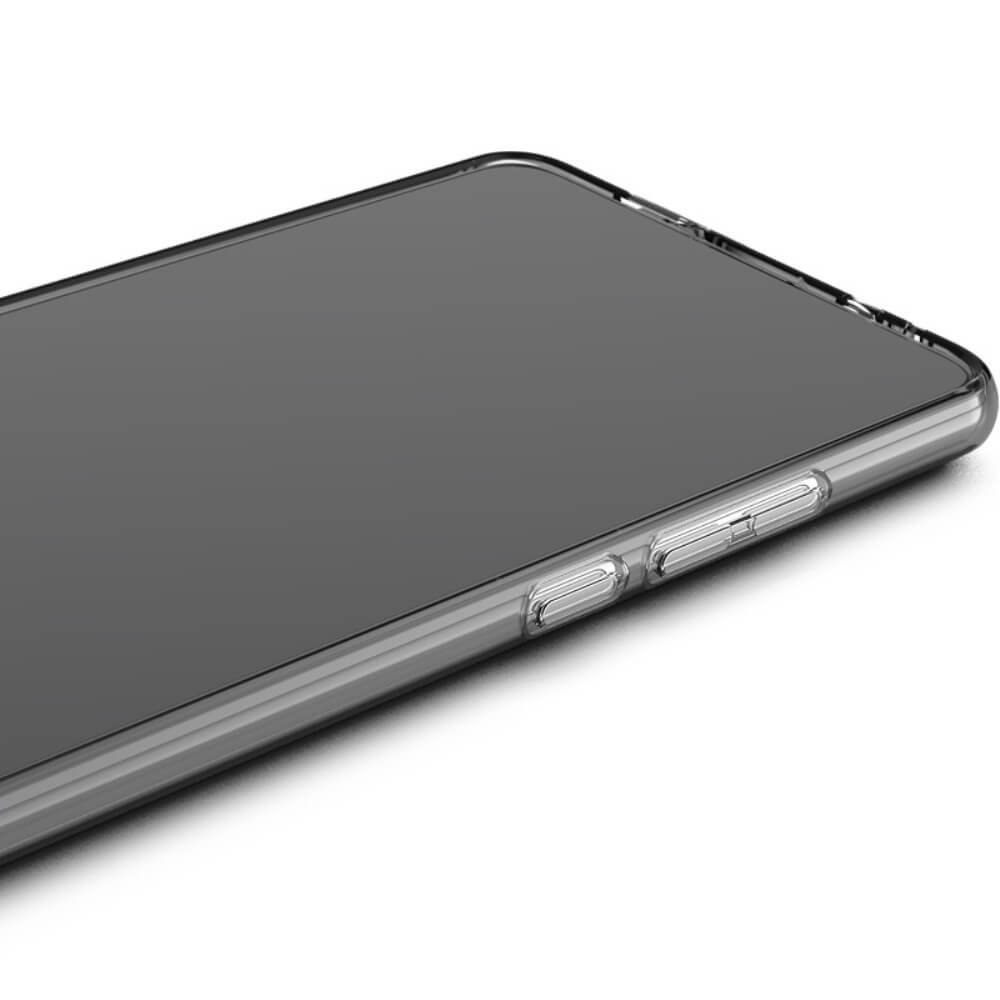 Gros plan d'une coque de téléphone transparente avec boutons gris.