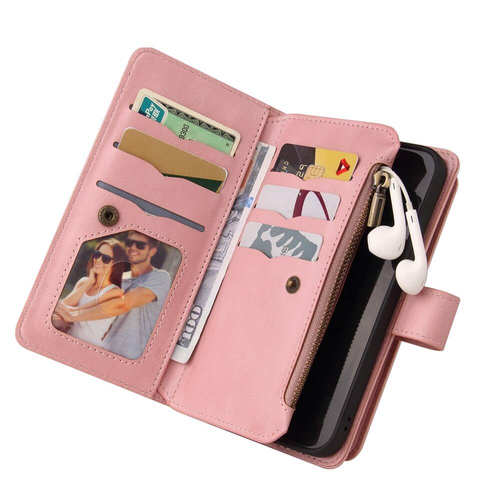 Un étui de téléphone portefeuille rose avec emplacement photo, porte-cartes, argent et écouteurs.