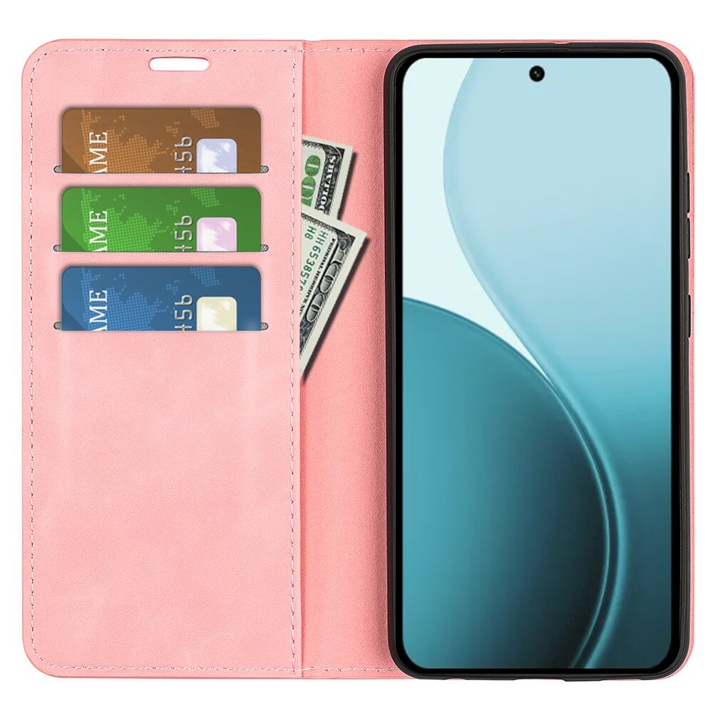 Un étui de téléphone rose avec trois fentes pour cartes et des billets à côté d'un smartphone.