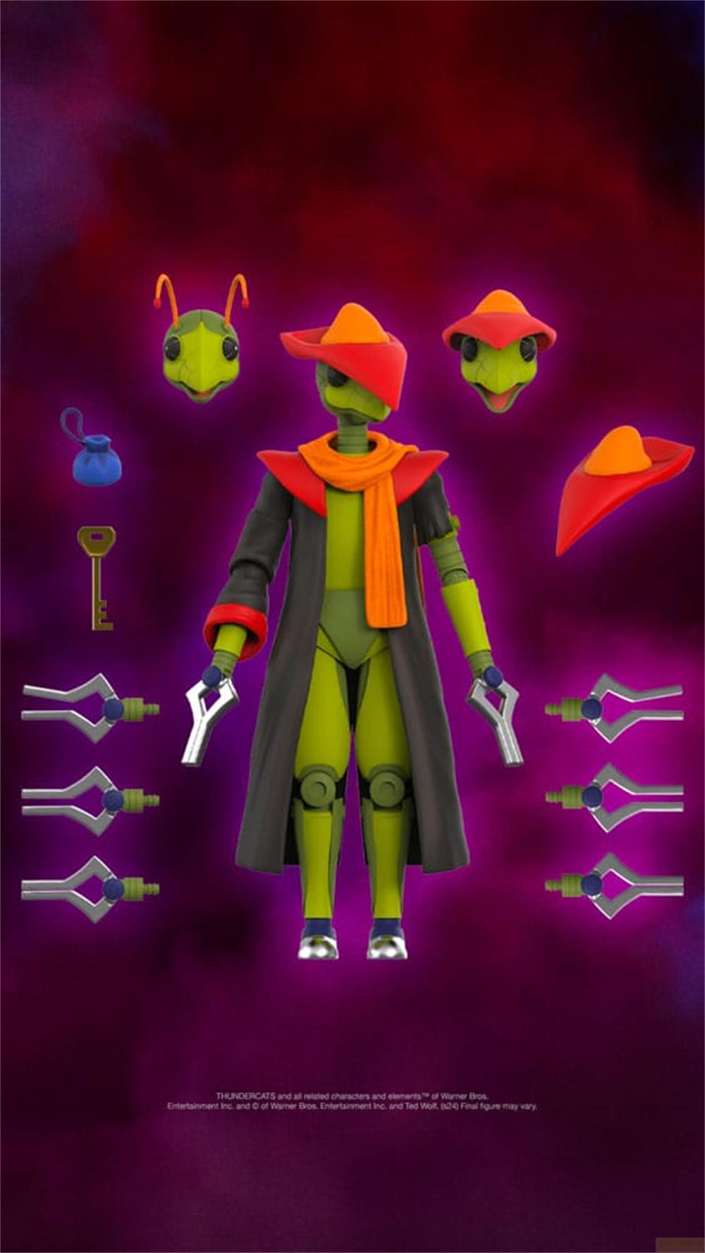 Grüne Figur mit rotem Hut, Schal, Mantel, Schlüssel und Waffen.