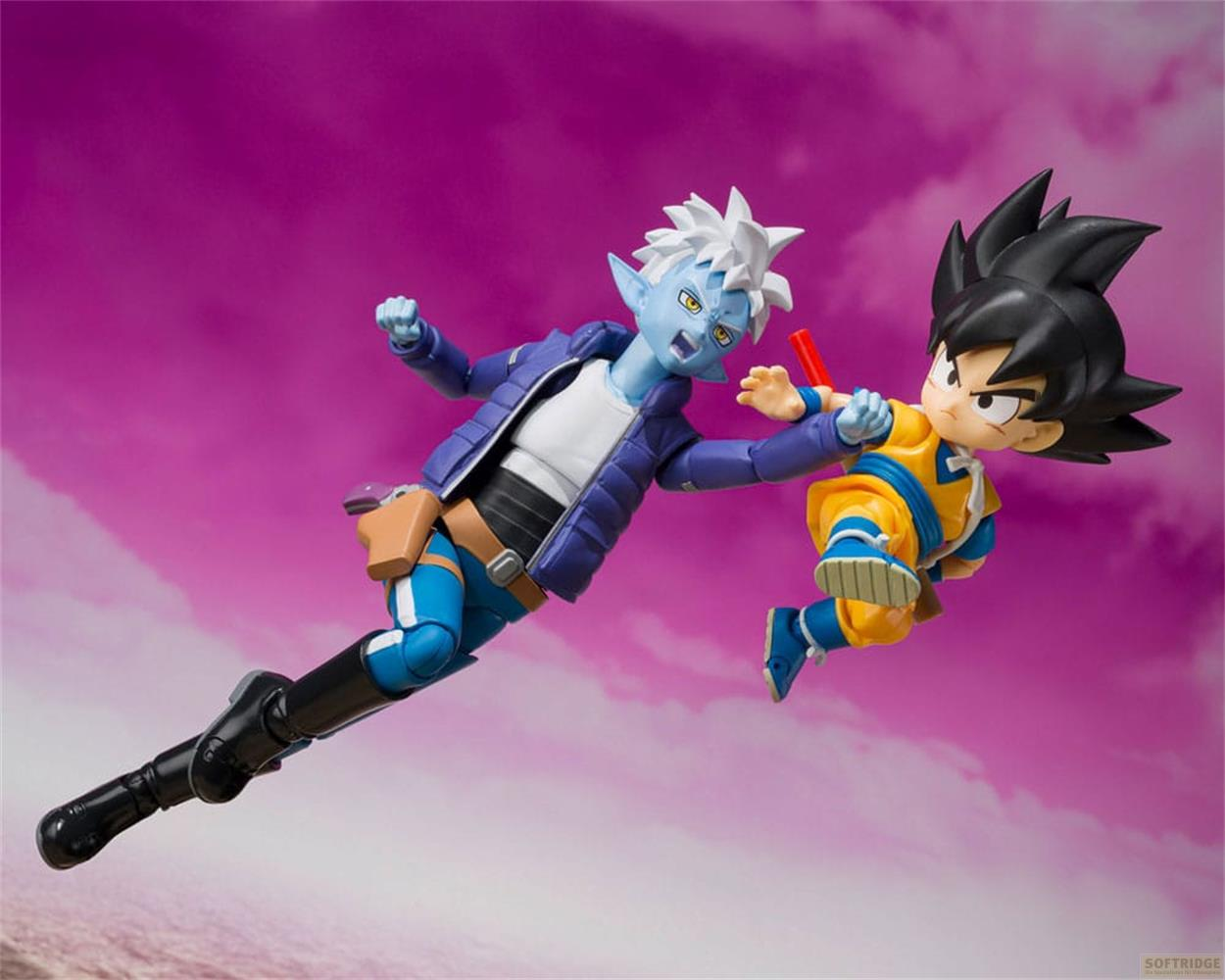 Zwei Actionfiguren kämpfen in der Luft mit violettem Himmel.
