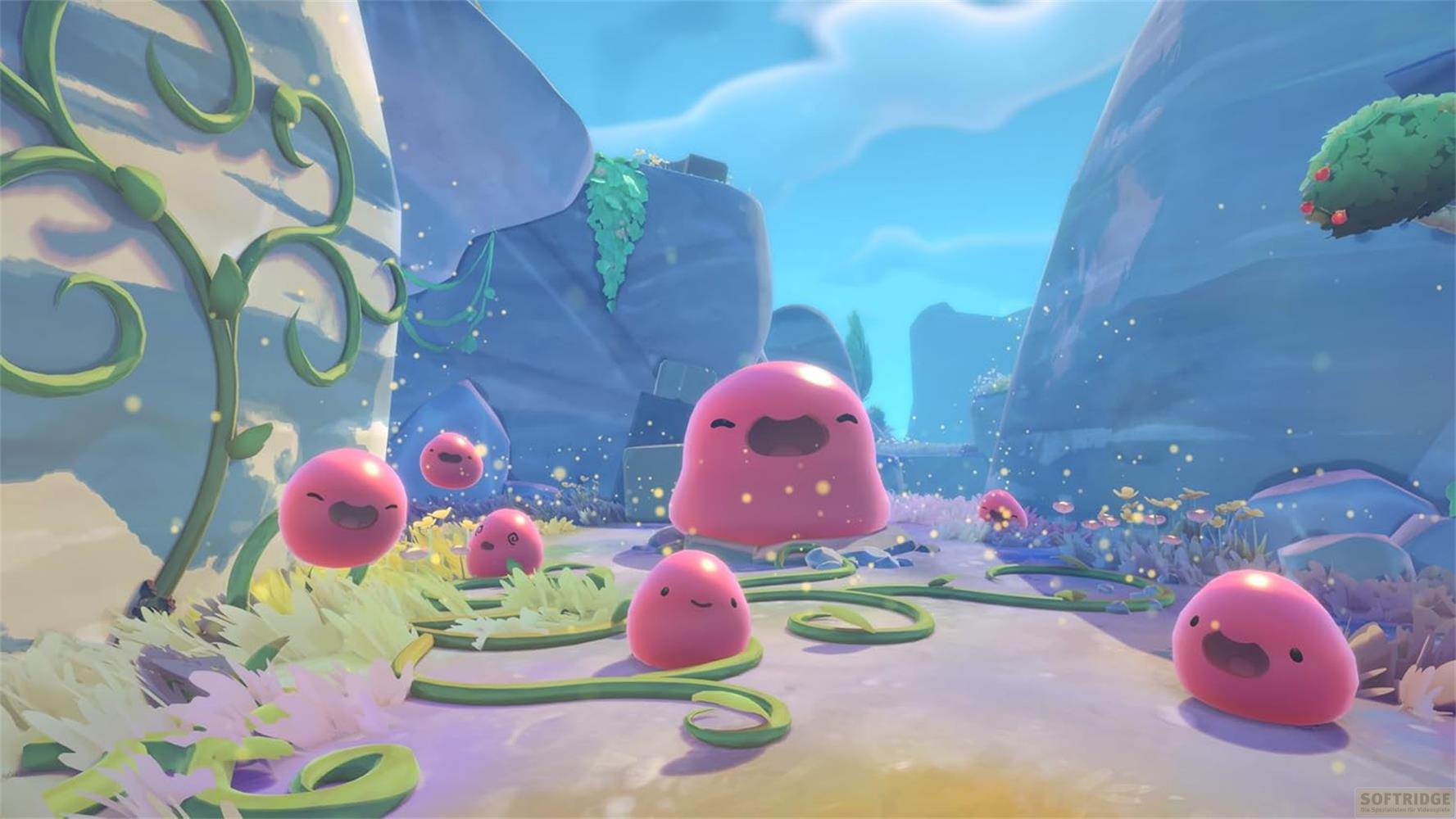 Plusieurs slimes roses aux visages souriants dans un paysage montagneux avec des plantes.