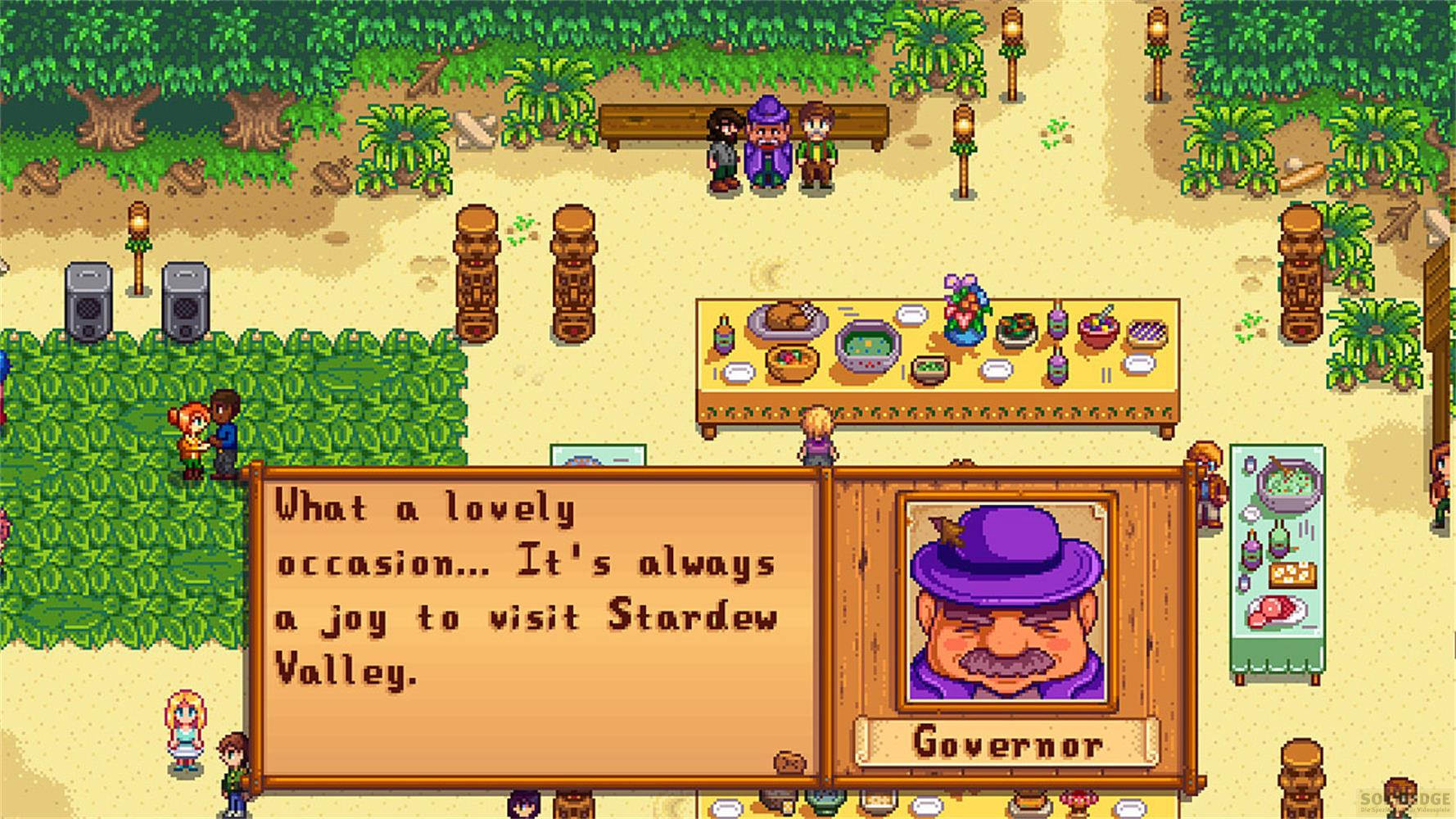 Der Gouverneur spricht über Stardew Valley vor einem Tisch mit Essen.